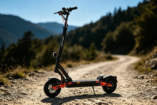 Joyor adult off‑road electric scooter on rocky mountain dirt trail, heavy‑duty foldable e‑scooter for outdoor adventure